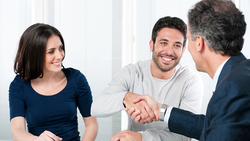couple shaking hands with salesman Grand Island Chevrolet in GRAND ISLAND NE